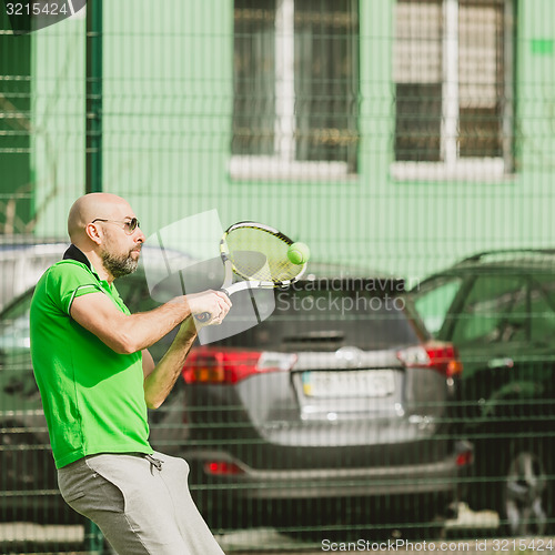 Image of man play tennis outdoor