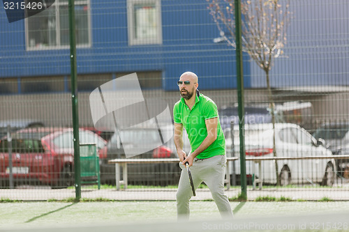 Image of man play tennis outdoor