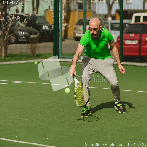 Image of man play tennis outdoor