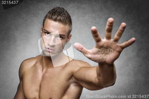 Image of Athlete holds up his hand