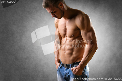 Image of Athlete in denim trousers