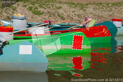 Image of Canoes on the Riverside