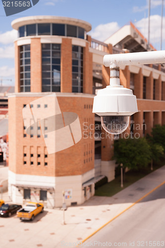 Image of Video Security Camera Housings Mounted High on College Campus