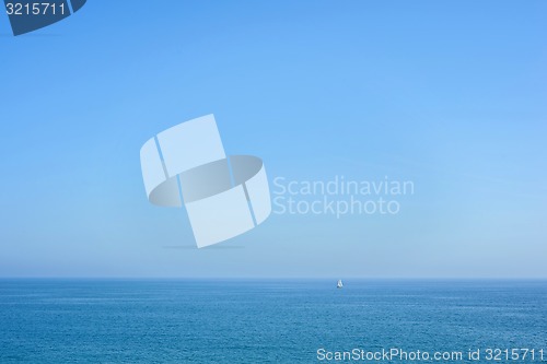 Image of Seascape with blue sea, sky and yacht