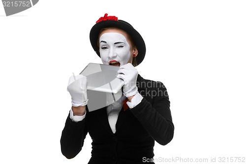 Image of business woman in the image mime holding tablet PC