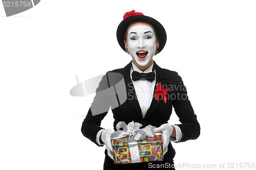 Image of Mime as playful, joyful and excited woman with gift 