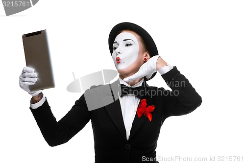 Image of business woman in the image mime holding tablet PC