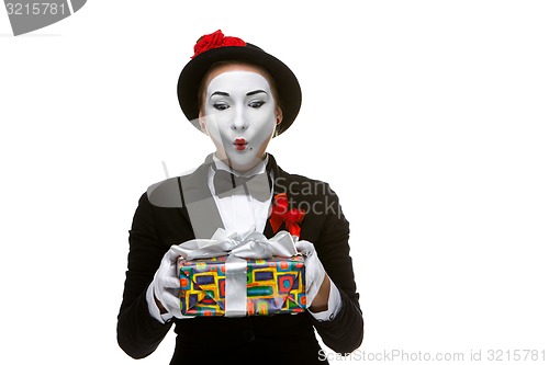 Image of Mime as playful, joyful and excited woman with gift 