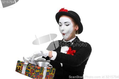 Image of Mime as playful, joyful and excited woman with gift 