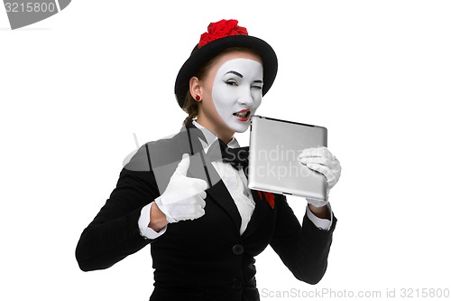 Image of business woman in the image mime holding tablet PC