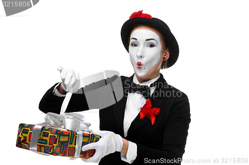 Image of Mime as playful, joyful and excited woman with gift 