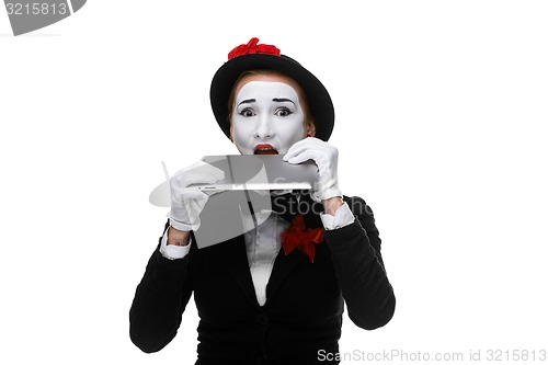 Image of business woman in the image mime holding tablet PC