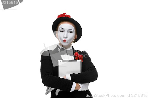 Image of business woman in the image mime holding tablet PC