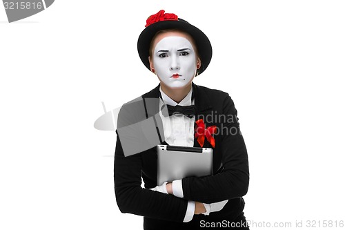 Image of business woman in the image mime holding tablet PC