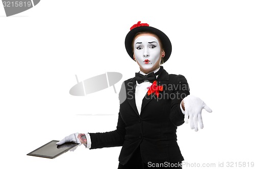 Image of business woman in the image mime holding tablet PC