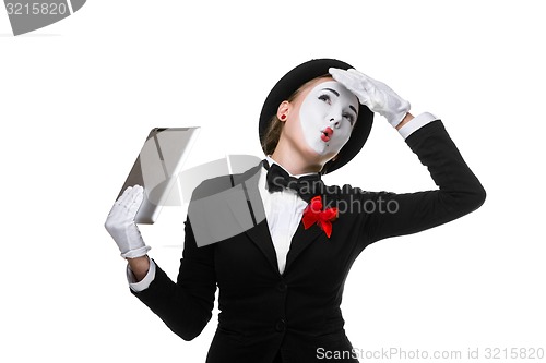 Image of business woman in the image mime holding tablet PC