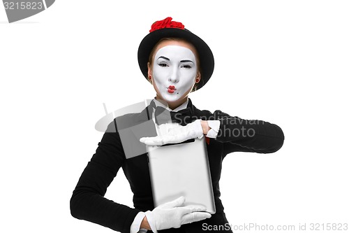 Image of business woman in the image mime holding tablet PC