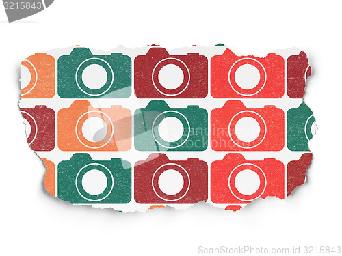 Image of Travel concept: Photo Camera icons on Torn Paper background