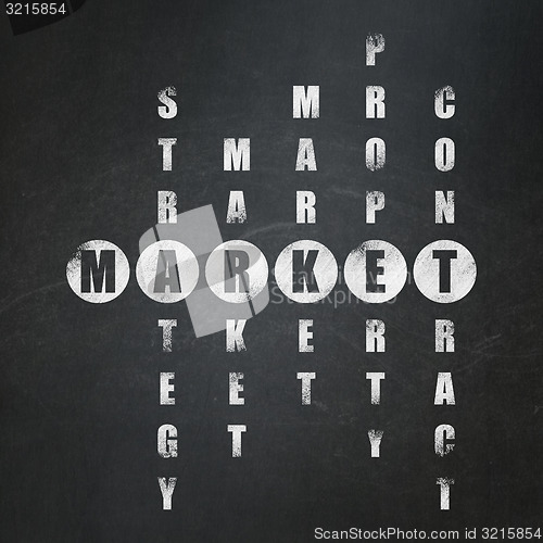 Image of Finance concept: word Market in solving Crossword Puzzle