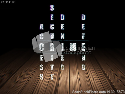 Image of Security concept: word Crime in solving Crossword Puzzle