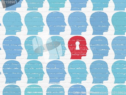 Image of Business concept: head with keyhole icon on wall background