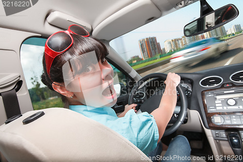 Image of Driving lessons. The woman behind the wheel.