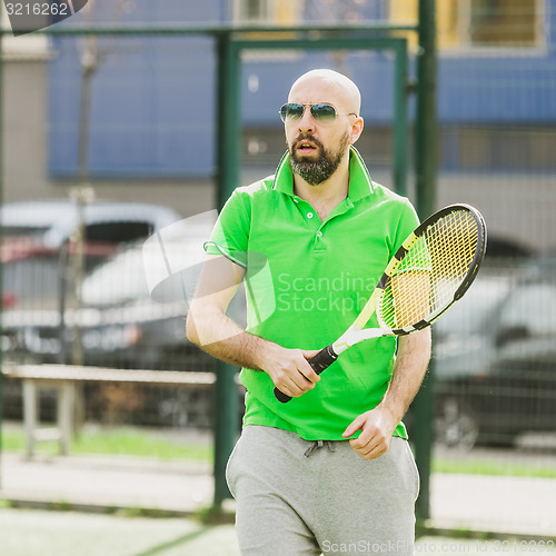 Image of man play tennis outdoor