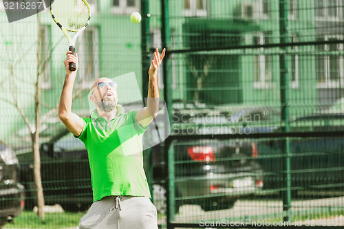 Image of man play tennis outdoor