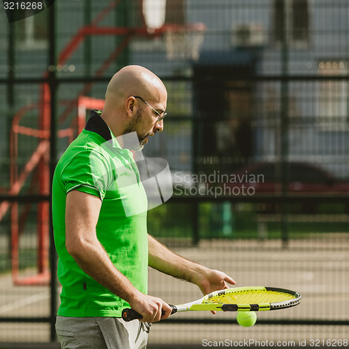 Image of man play tennis outdoor
