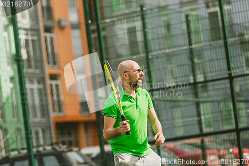 Image of man play tennis outdoor