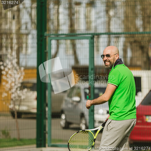 Image of man play tennis outdoor