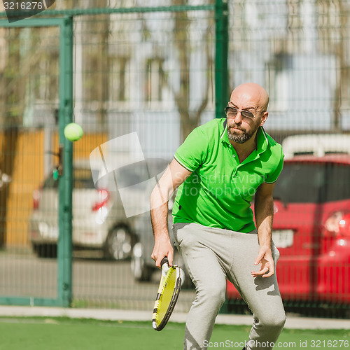 Image of man play tennis outdoor