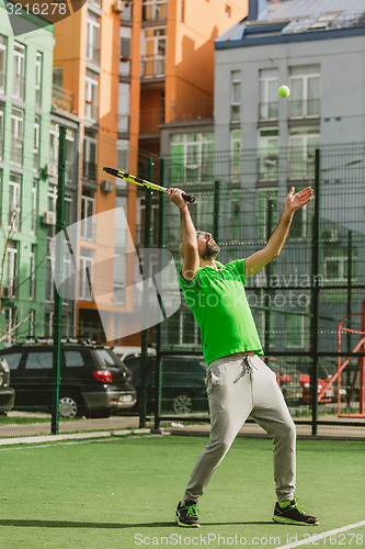 Image of man play tennis outdoor