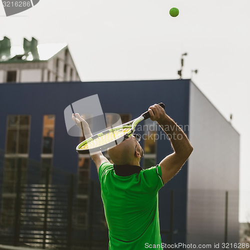 Image of man play tennis outdoor