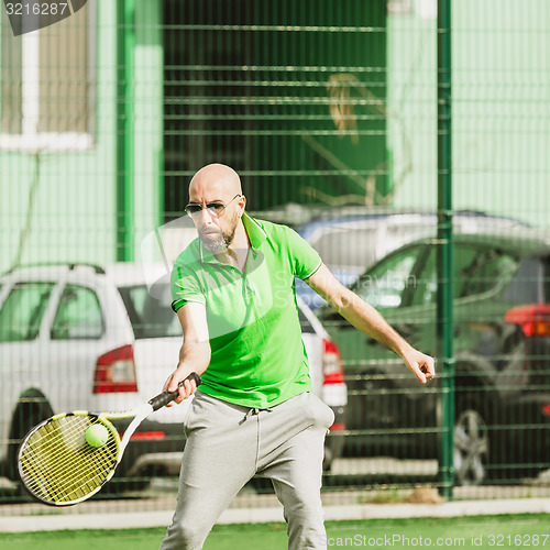 Image of man play tennis outdoor