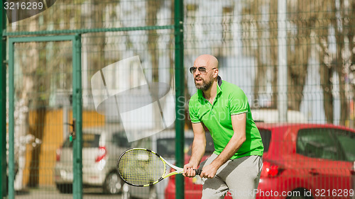 Image of man play tennis outdoor