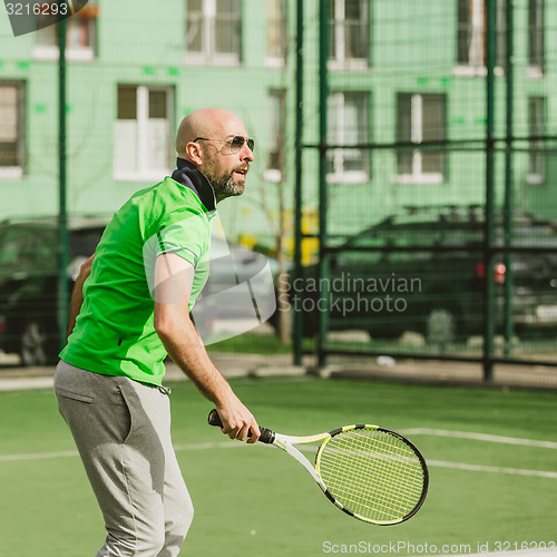 Image of man play tennis outdoor