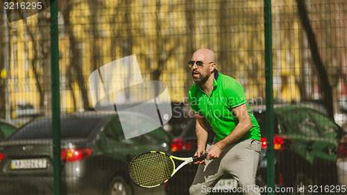Image of man play tennis outdoor