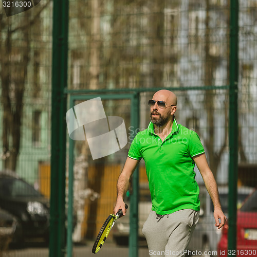 Image of man play tennis outdoor