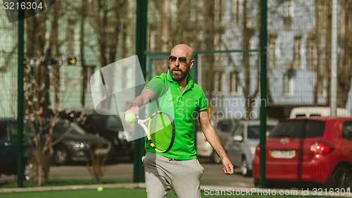 Image of man play tennis outdoor