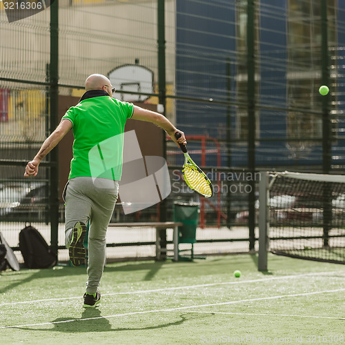 Image of man play tennis outdoor