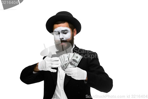 Image of mime as businessman holding money