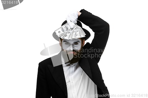 Image of mime as businessman holding money