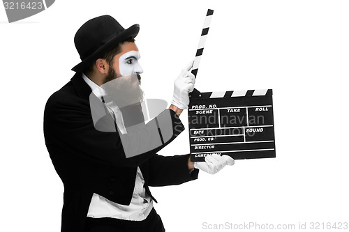 Image of man in the image mime with movie board