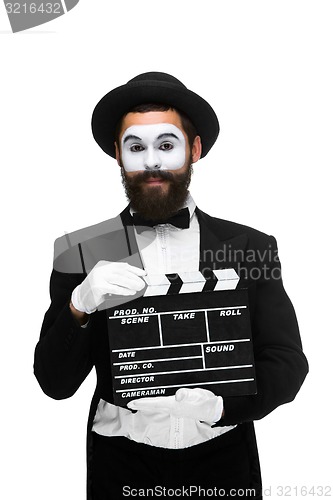 Image of man in the image mime with movie board