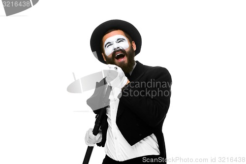 Image of portrait of a man as mime with tube or retro style microphone