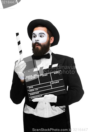 Image of man in the image mime with movie board