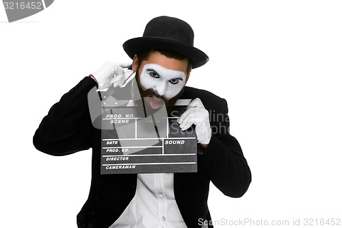 Image of man in the image mime with movie board