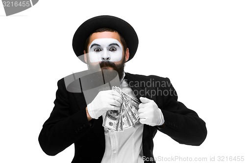 Image of mime as businessman putting money in his pocket