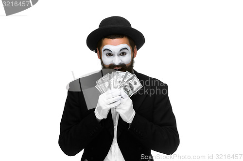 Image of mime as a businessman holding dollar bills  